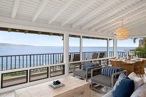 Relax on the spacious wraparound oceanfront lanai with comfortable seating, bistro dining, and breathtaking views of the Pacific Ocean and neighboring islands.