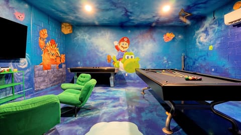 Mario Galaxy Games Room: Immersive games room with a full-size pool table, air hockey and hand-painted Mario murals covering the walls, ceiling and floor.