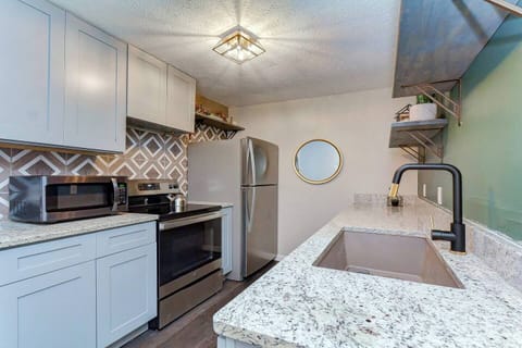 Modern granite counter, stainless appliances and dishwasher, and undermount granite sink. Your kitchen includes all the  pots and pans, drip coffee maker with Columbian coffee, and accountrements you need to make a fabulous meal!