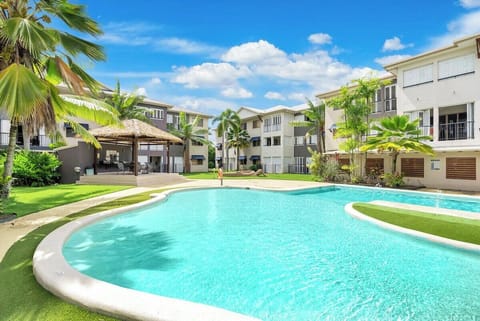Dive into the shared pool, surrounded by lush greenery. It’s a tranquil haven where you can relax, sunbathe, or take a refreshing swim, perfect for unwinding and enjoying the tropical atmosphere.