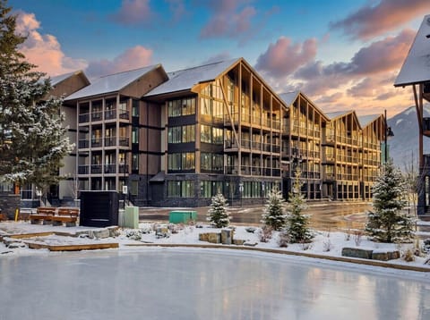 rocky-mountain-resort-condo-exterior-winter-outdoor-skating-rink-sunset