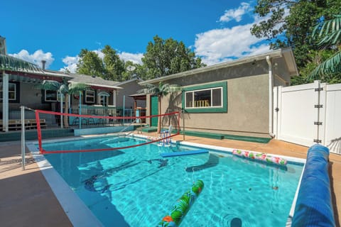 Welcome to Aloha Springs! A private heated pool anchors the fully fenced backyard, with floats and a volleyball net already set out. Afternoons here run long once the water warms up through the middle of the summer.