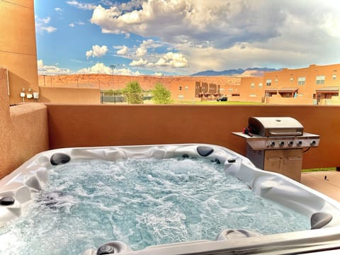 Private hot tub on back patio facing mountain