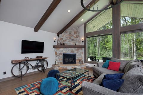 Stretch out on the sectional and savor the woodland scenery.