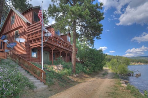 Cozy, lakefront, log cabin, with views and plenty of private, outdoor spaces.