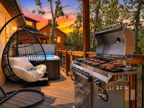 Beautiful deck with a hot tub to unwind after a busy day in Branson or just hanging at Tall Timbers.  Enjoy some burgers and other grilled goodies while relaxing. 