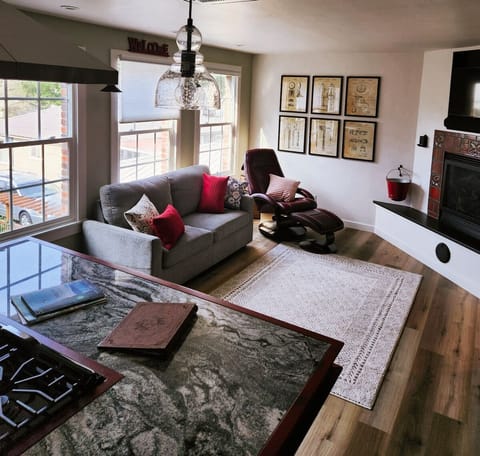 fireplace, interior, indoor, couch, living area, television, daytime