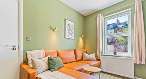 Cosy living room with comfortable seating for relaxing after a busy day.