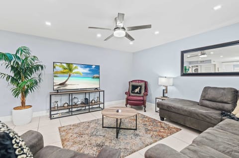 Spacious living room with comfortable seating and Smart TV.