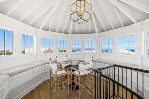 Settle into this stunning circular loft with sweeping windows framing breathtaking ocean views. The airy vaulted ceiling and elegant chandelier create a bright, relaxing retreat perfect for watching the waves.