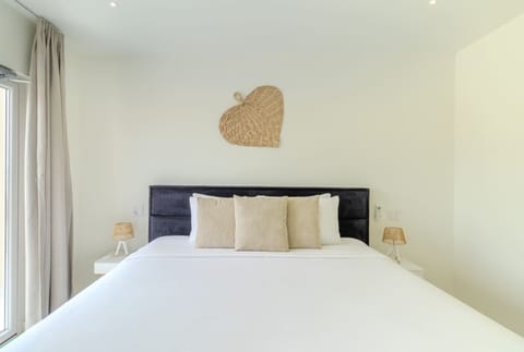 Villa Twin A’s Bedroom 1, featuring a comfortable king bed for a restful stay.