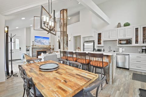 Gather around this handcrafted dining table where your group can share meals and make memories together. The open kitchen invites you to cook and connect in a bright, airy space.