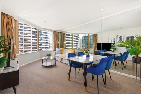 Enjoy a bright, open-plan setting where generous bay windows, contemporary furnishings and mirrored walls create a refined base for unwinding between Sydney adventures.