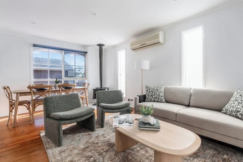 Designed for easy holiday living, the open-plan living and dining area offers a welcoming space to unwind, dine and reconnect after exploring the Mornington Peninsula.