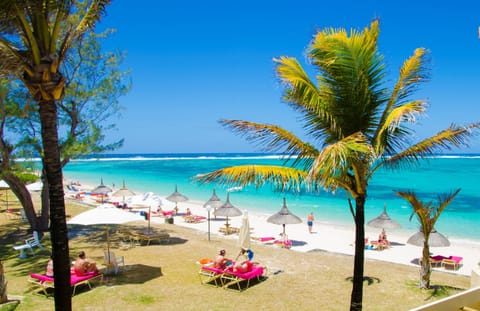 Beach nearby, white sand, sun loungers, beach umbrellas