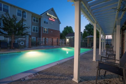 Unwind poolside at dusk with a soothing, resort glow.