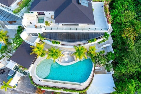 Spectacular Pool Oasis: Dive into tranquility with stunning views and vibrant tropical landscaping!