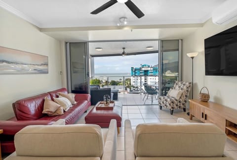 Stretch out in the inviting living area, where comfortable furnishings and calming coastal views create a welcoming place to reconnect.