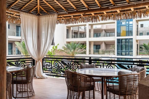 Gather under the palapa for an easygoing break from the sun