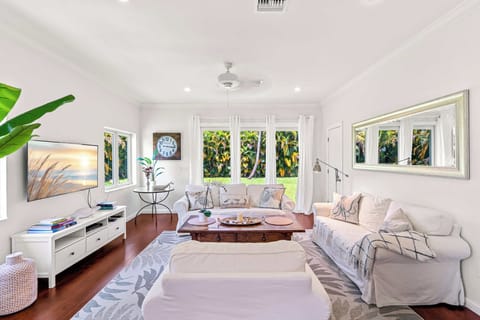 The living room has has lots of windows and is nice and bright.