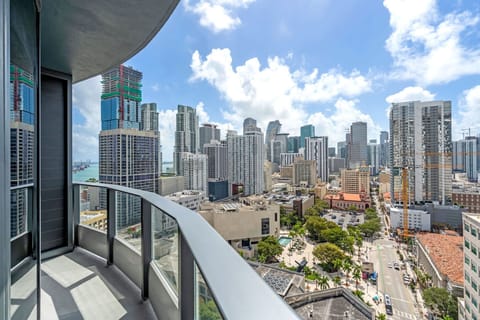 Soak in the sun and the city! This private balcony features stylish mesh seating and a bistro table, perfect for enjoying your morning coffee while gazing at the stunning panoramic views of downtown Miami from the 25th floor.