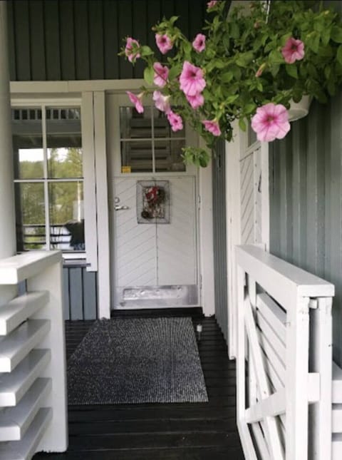 Sheltered entrance porch leading to the front door.