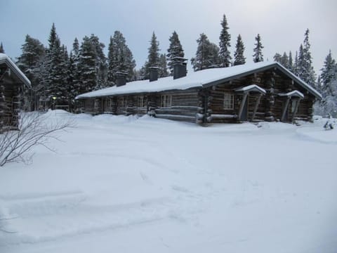 Exterior of the property blanketed in snow during the winter season.