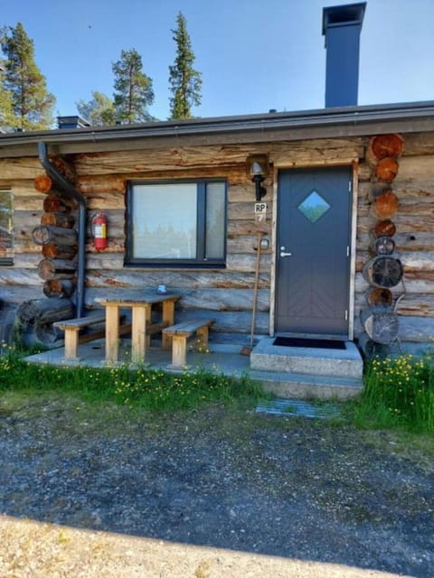 Private entrance with a cozy outdoor seating area right by the front door.