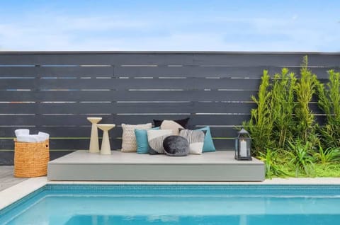 Seasonal Heated Pool | Shared with Other Units in Building | Outdoor Couch Seating