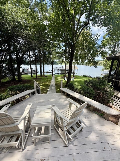 View of waterfront and private pier from patio