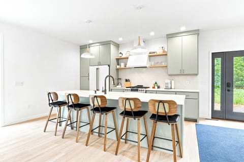 Premium Amenities: Fully equipped with a sleek gas stove, modern appliances, and a spacious refrigerator.