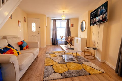 Bright, stylish lounge with Netflix ready smart TV and warm modern touches to unwind