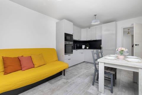 Relax in the stylish living room with a comfortable sofa and modern decor.