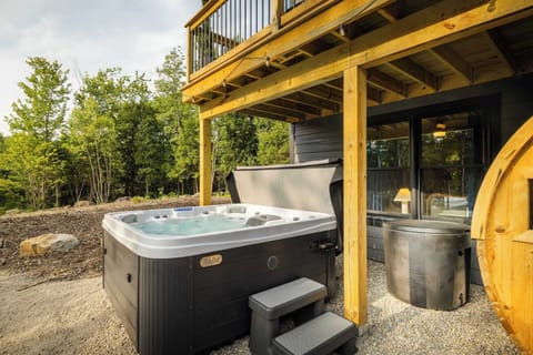 Sore legs after a day in the White Mountains? Sink into the private hot tub tucked under the deck and let the forest do the rest. This is what recovery should feel like.