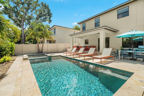 Your private oasis awaits—lounge poolside under swaying palms, soak up the sunshine, and unwind with outdoor dining steps from the sparkling water.