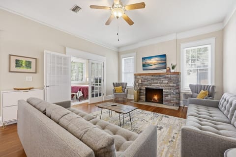 Living Room: Expansive living room with comfortable sectional seating, decorative fireplace, and plenty of space to gather.