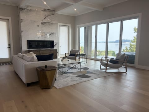 Welcome to Lochside d'Amour! Enjoy the soaring ceilings and light oak floors accent this open-concept main living area.