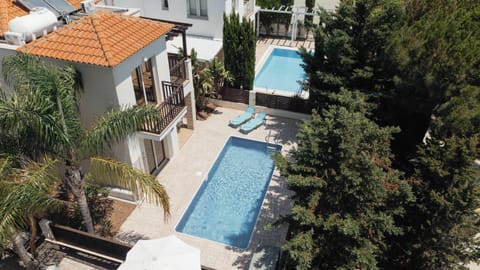 Your private Mediterranean escape with a swimming pool, palm trees, and sunshine all day long.