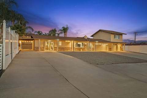 Spacious driveway with easy parking and a welcoming single-story home.