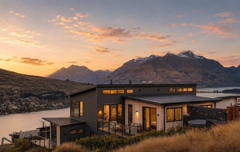 The house at dusk, with the Cecil Peak behind it