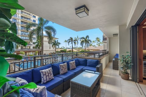 Take the shaded end of the lanai first, where the deep overhang keeps the sun off the sectional all afternoon.