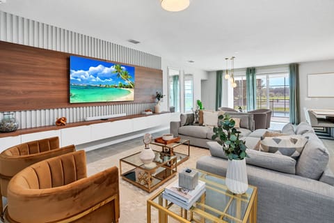 Relax in this luxurious living room with plush seating, modern decor, and stunning outdoor views—perfect for unwinding after a day of adventure.