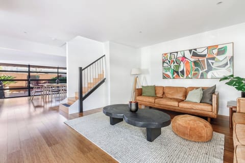 Enjoy seamless indoor flow from the living area to the dining area and kitchen, enhanced by warm timber flooring and a beautifully open layout.