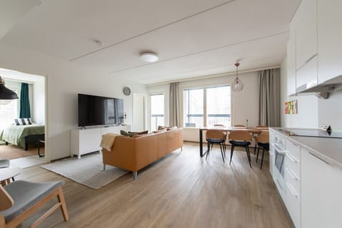 The kitchen, dining area and living room are all one space. The second bedroom is first on the left and master bedroom entrance is next to the balcony door.
