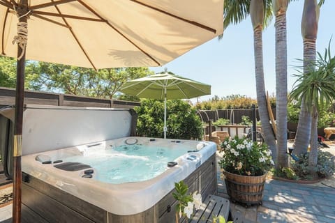 Hot Tub | Soak under palm trees in your private 7-person outdoor spa.
