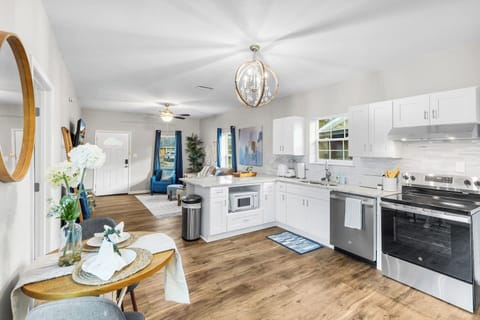 Enjoy our open-concept eat-in kitchen. This social hub overlooks the living area, keeping the group together. Keyless entry makes unloading groceries easy. Professionally cleaned and dishes provided for a seamless stay.
