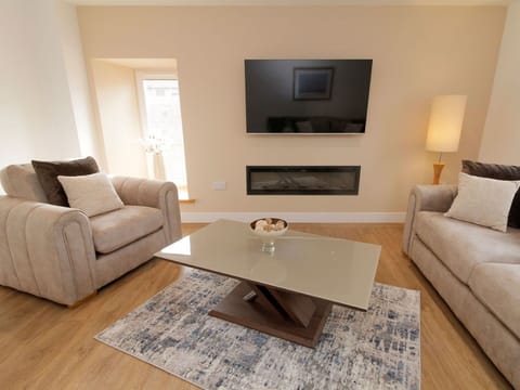 Furniture, Couch, Flooring, Interior Design, Floor, Living Room, Brown, Room, Home