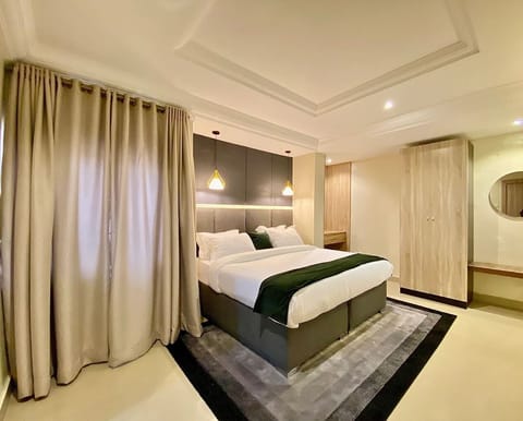 Deluxe Apartment, Balcony, City View | Desk, laptop workspace, blackout drapes, soundproofing
