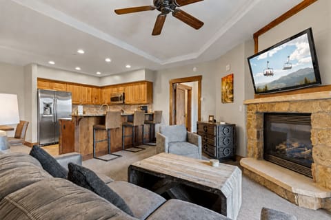 Unwind in your cozy living area with a crackling fireplace and mountain charm, or prep meals in the fully equipped kitchen—perfect for relaxing after a day of adventure.