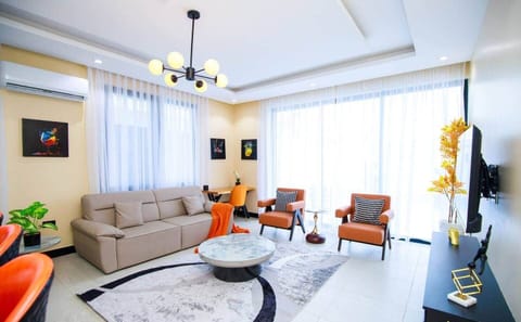SPACIOUS LIVING ROOM  with a sofa, chairs
and large windows. We have recently added blackout curtains!